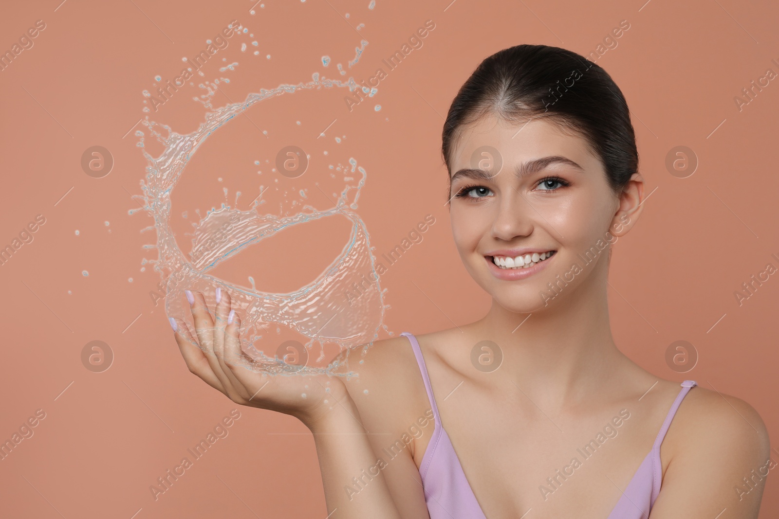 Woman with smooth skin and water splashes on light brown background Image of Woman with smooth skin and water splashes on light brown background