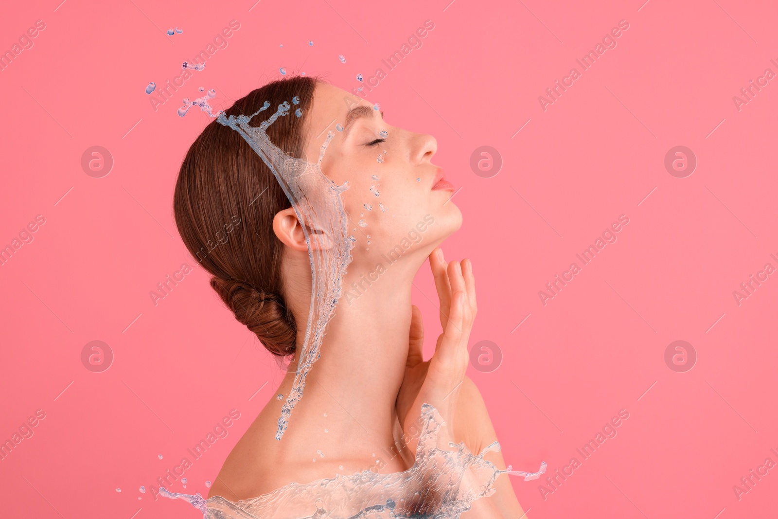Image of Young woman with smooth skin and water splashes on pink background. Space for text