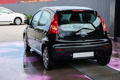 Photo of Clean auto after washing at outdoor car wash