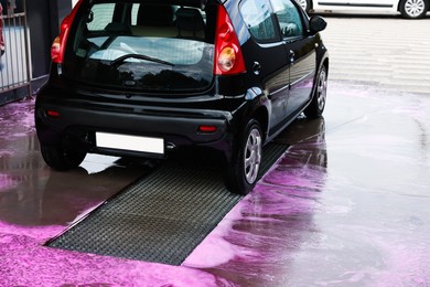 Photo of Clean auto after washing at outdoor car wash
