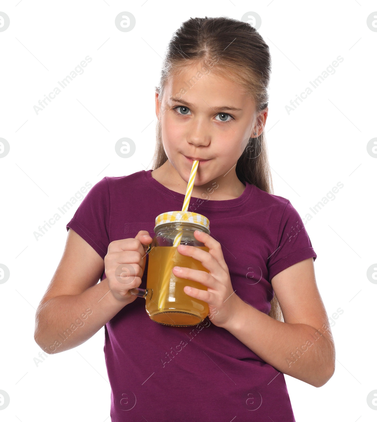 Little girl drinking juice through straw on white background Photo of Little girl drinking juice through straw on white background