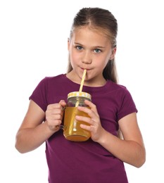 Photo of Little girl drinking juice through straw on white background