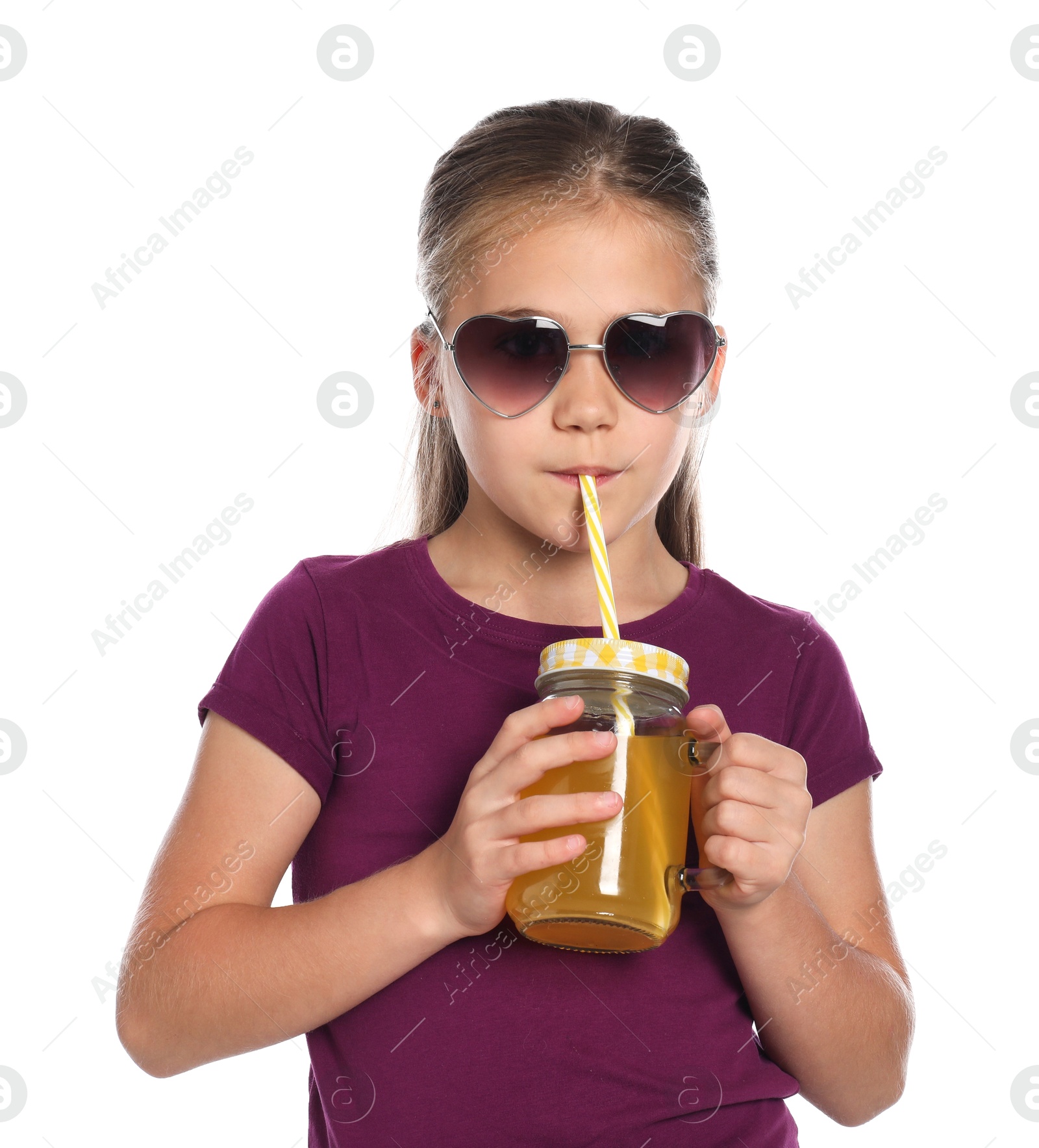 Photo of Little girl drinking juice through straw on white background