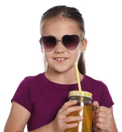 Photo of Little girl with juice and drinking straw on white background