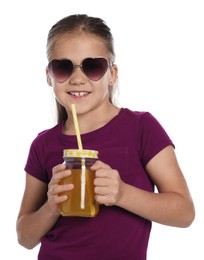 Photo of Little girl with juice and drinking straw on white background
