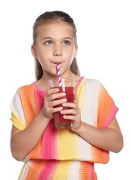 Photo of Little girl drinking juice through straw on white background