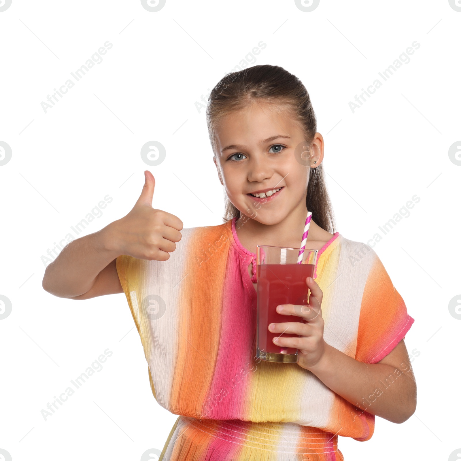 Photo of Little girl with juice and drinking straw showing thumbs up on white background