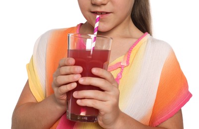 Photo of Little girl drinking juice through straw on white background, closeup