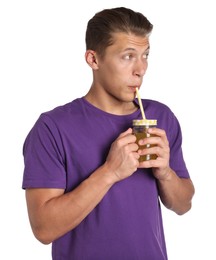 Photo of Man drinking juice through straw on white background
