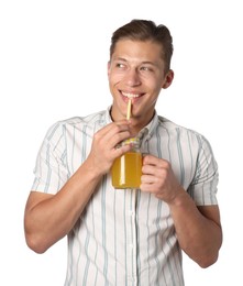 Photo of Man drinking juice through straw on white background