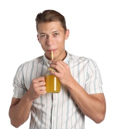 Photo of Man drinking juice through straw on white background