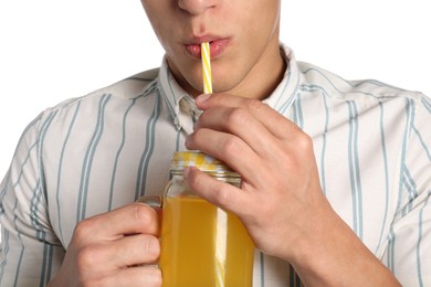 Photo of Man drinking juice through straw on white background, closeup