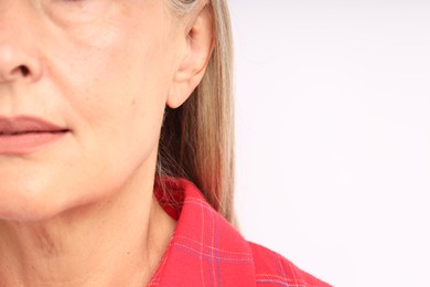 Photo of Woman with healthy skin on light background, closeup. Space for text