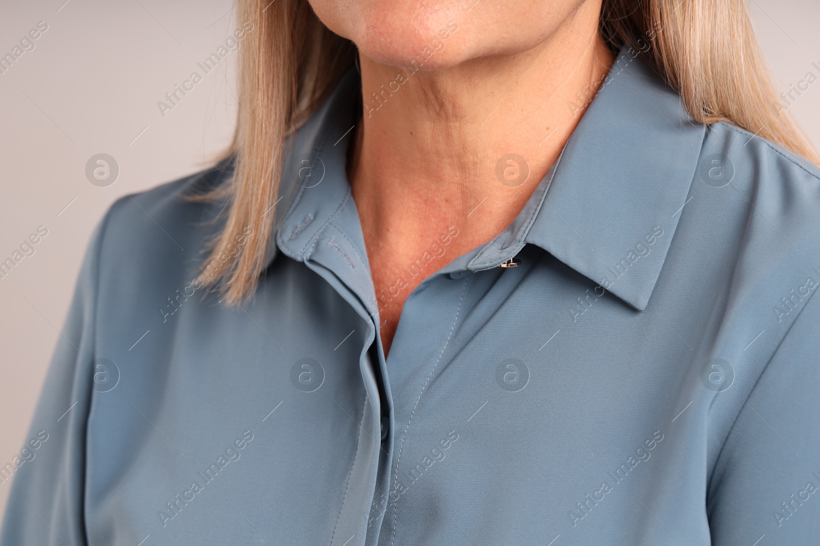 Woman with healthy skin on light background, closeup Photo of Woman with healthy skin on light background, closeup