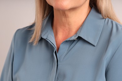 Photo of Woman with healthy skin on light background, closeup