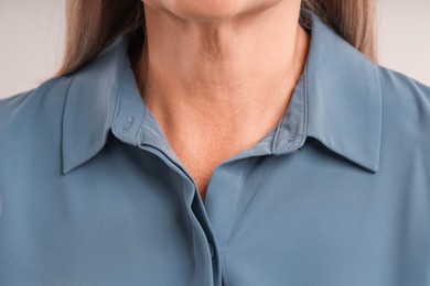 Photo of Woman with healthy skin on light background, closeup