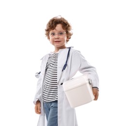 Photo of Choice of profession. Little boy with stethoscope and first aid kit pretending to be doctor on white background