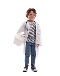 Photo of Choice of profession. Little boy with stethoscope and first aid kit pretending to be doctor on white background