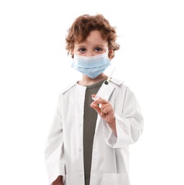 Photo of Choice of profession. Little boy in medical mask with syringe pretending to be doctor on white background