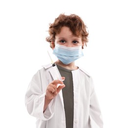 Photo of Choice of profession. Little boy in medical mask with syringe pretending to be doctor on white background