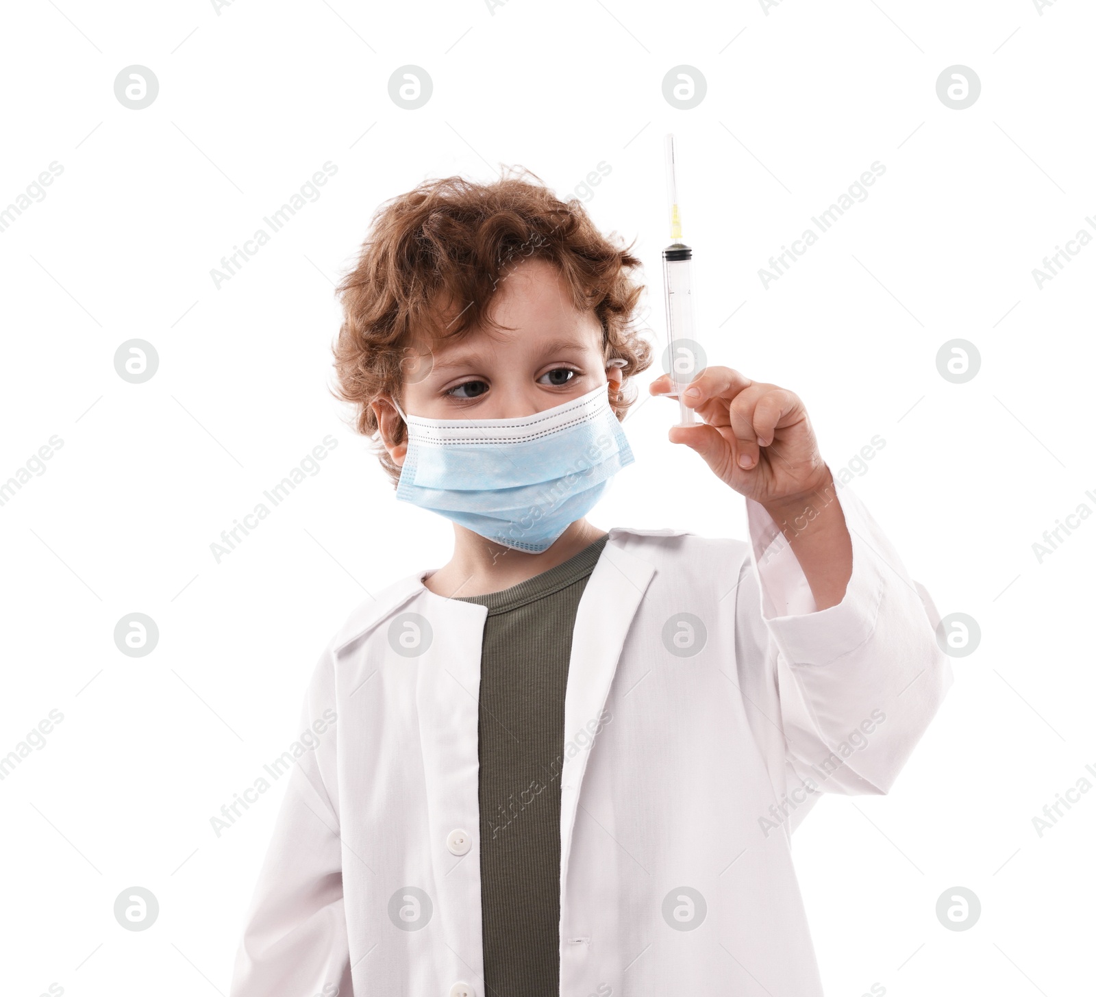 Choice of profession. Little boy in medical mask with syringe pretending to be doctor on white background Photo of Choice of profession. Little boy in medical mask with syringe pretending to be doctor on white background