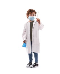 Photo of Choice of profession. Little boy in medical mask with syringe and glove pretending to be doctor on white background