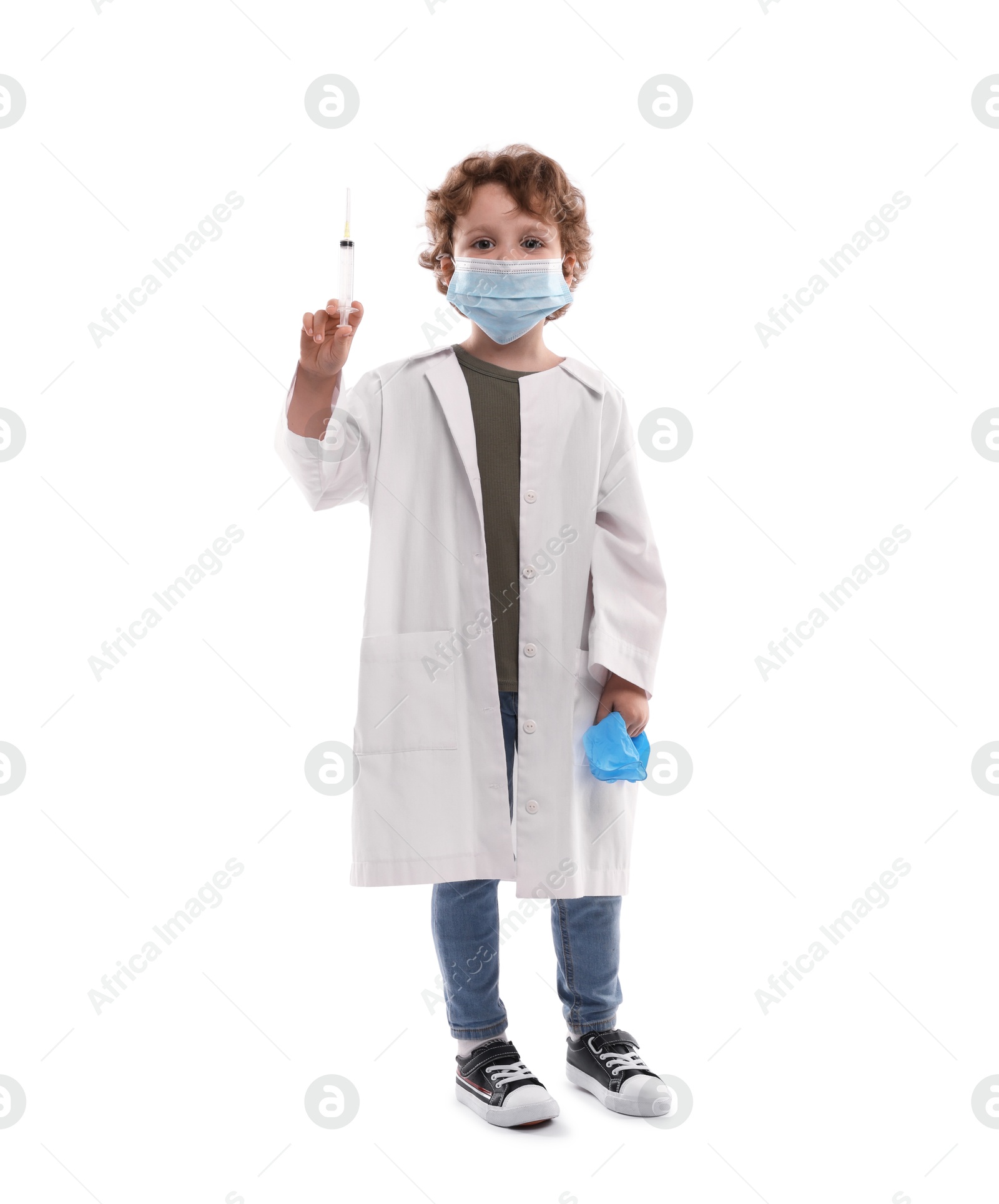 Choice of profession. Little boy in medical mask with syringe and glove pretending to be doctor on white background Photo of Choice of profession. Little boy in medical mask with syringe and glove pretending to be doctor on white background