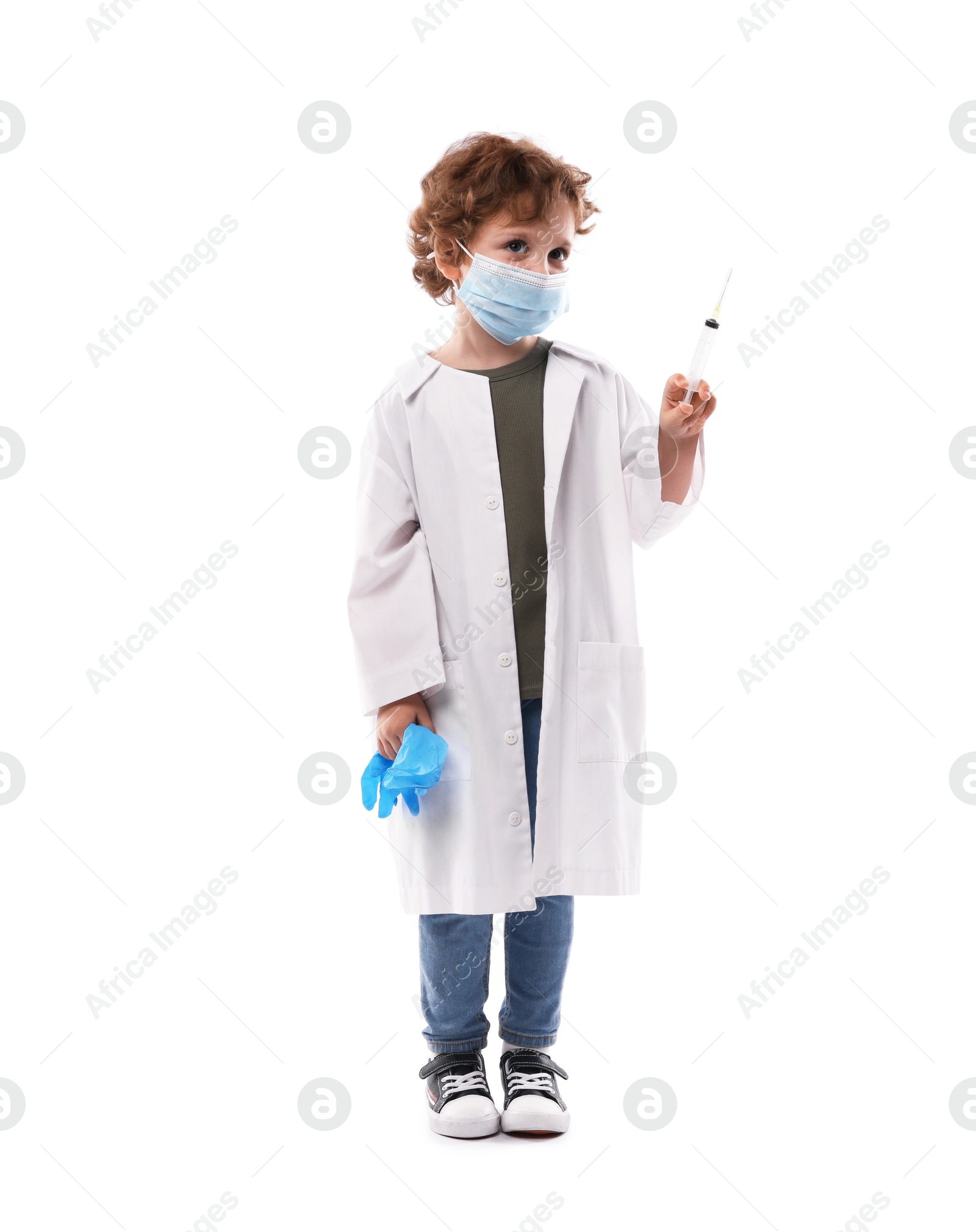 Choice of profession. Little boy in medical mask with syringe and glove pretending to be doctor on white background Photo of Choice of profession. Little boy in medical mask with syringe and glove pretending to be doctor on white background
