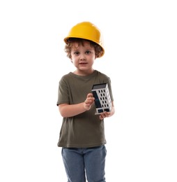 Photo of Choice of profession. Little kid in hard hat with house model pretending to be engineer on white background