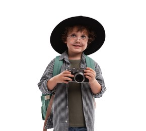 Photo of Choice of profession. Little boy in hat with camera pretending to be photographer on white background