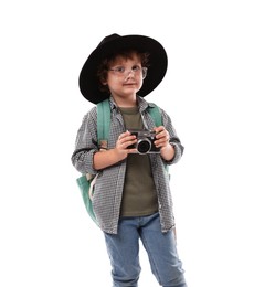 Photo of Choice of profession. Little boy in hat with camera pretending to be photographer on white background