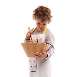 Photo of Choice of profession. Little boy with wooden bowl and spoon pretending to be chef on white background