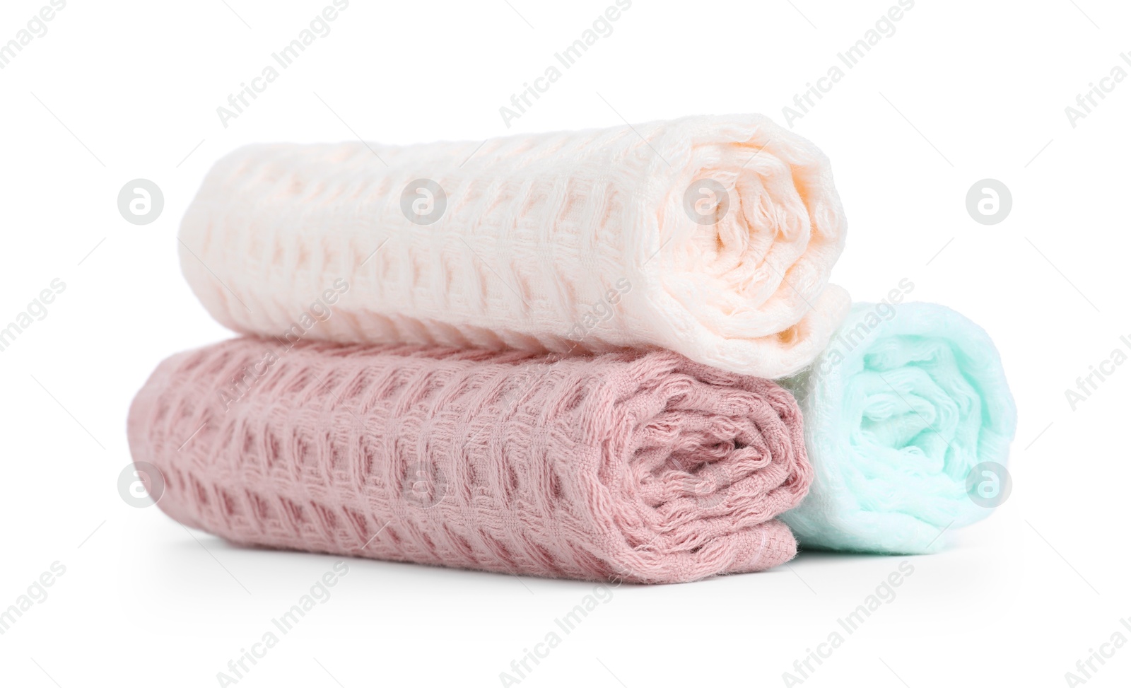 Photo of Soft rolled waffle towels isolated on white