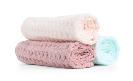 Photo of Soft rolled waffle towels isolated on white