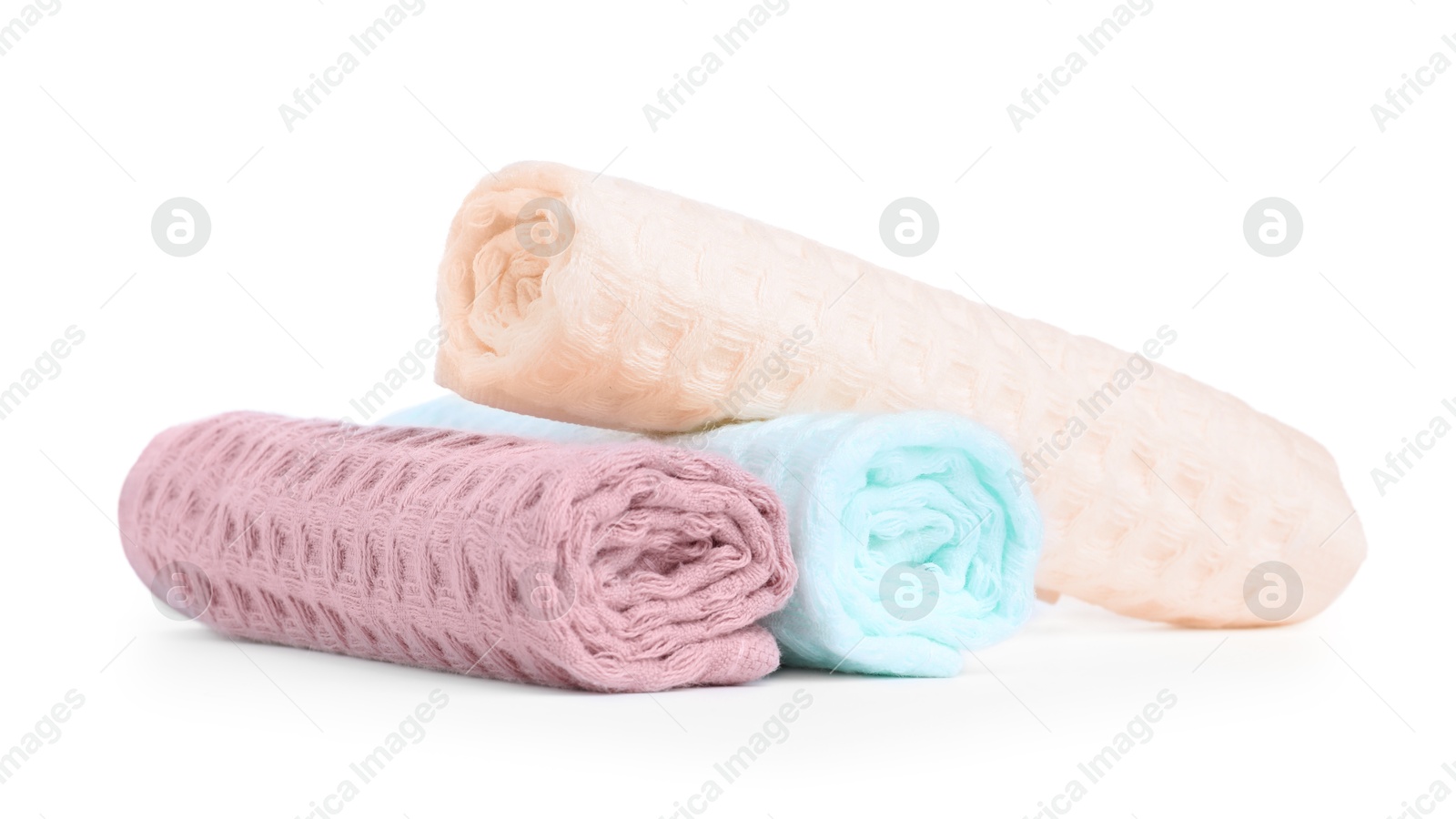 Photo of Soft rolled waffle towels isolated on white