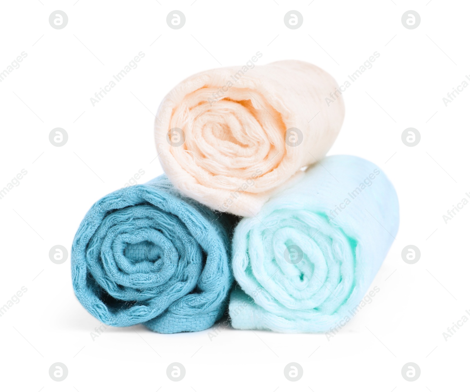 Photo of Soft rolled waffle towels isolated on white