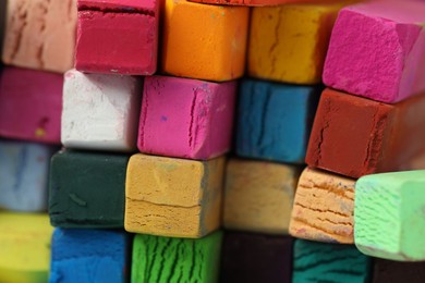 Photo of Many colorful chalk pastels as background, closeup