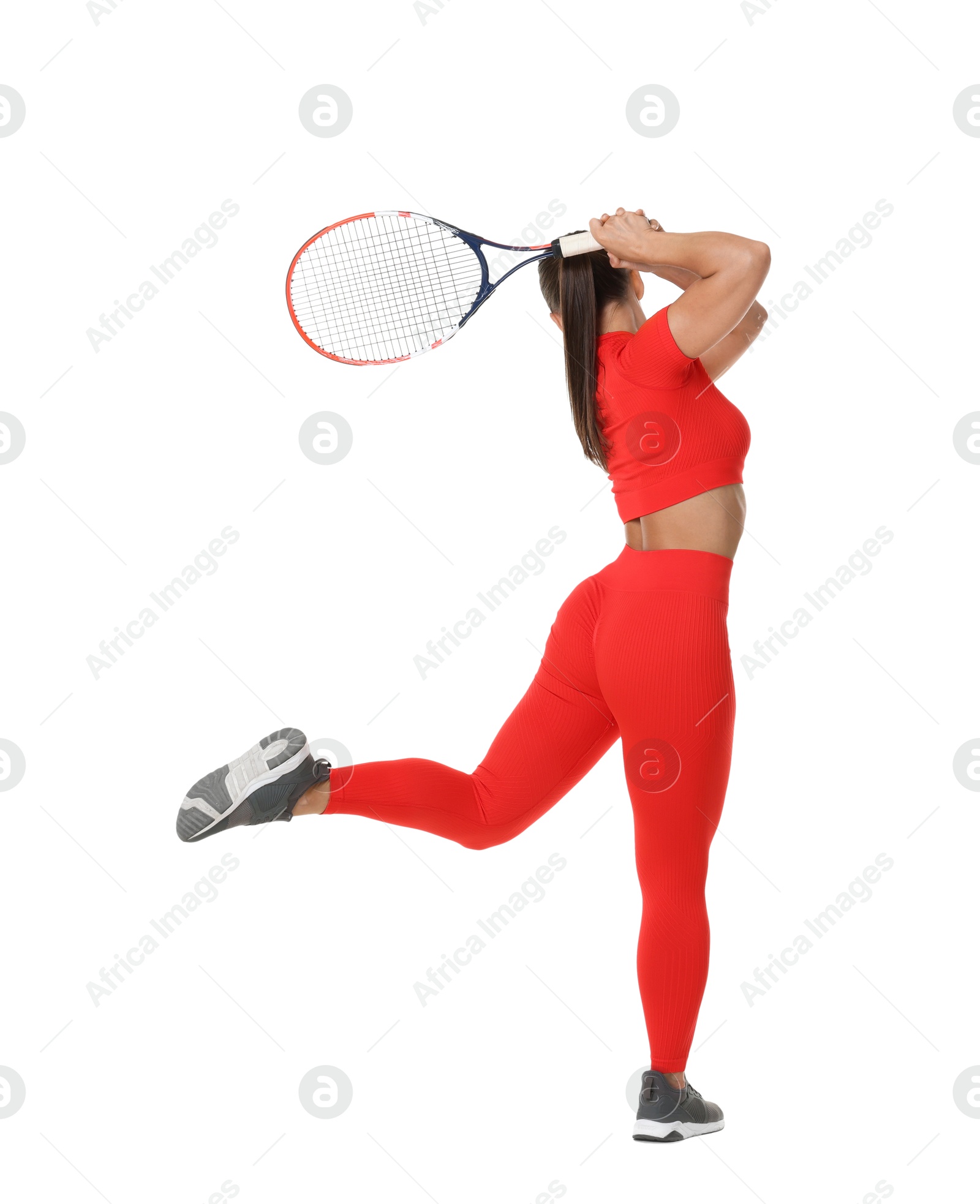 Woman with racket playing tennis on white background, back view Photo of Woman with racket playing tennis on white background, back view