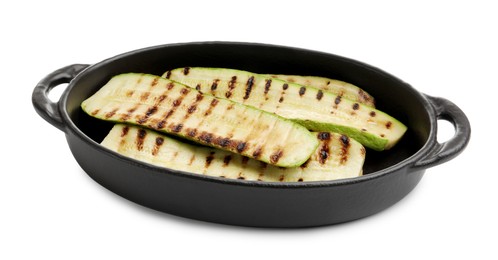 Photo of Delicious grilled courgette slices in baking dish isolated on white