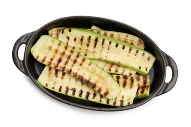 Photo of Delicious grilled courgette slices in baking dish isolated on white, top view