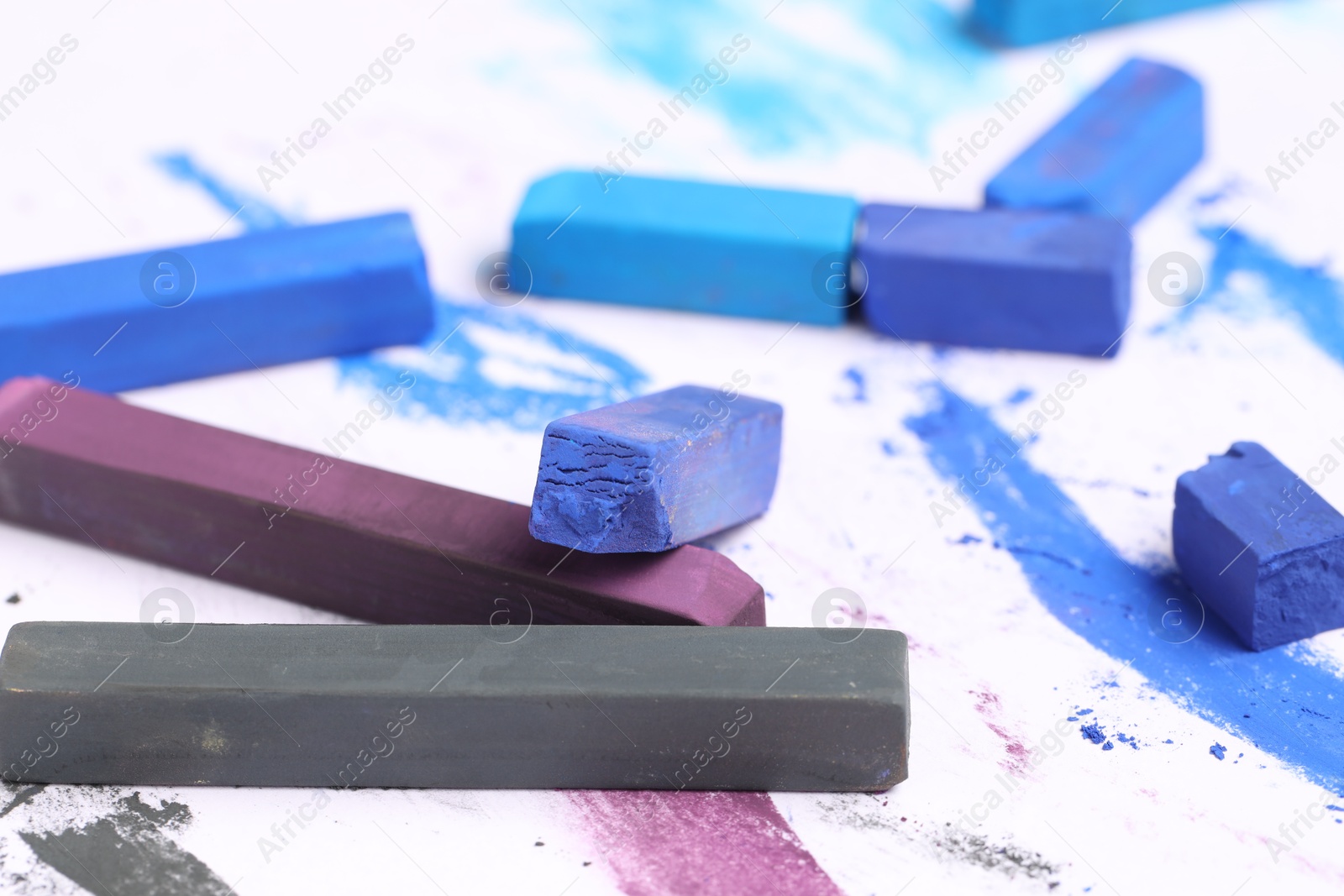 Colorful chalk pastels on white background, closeup Photo of Colorful chalk pastels on white background, closeup