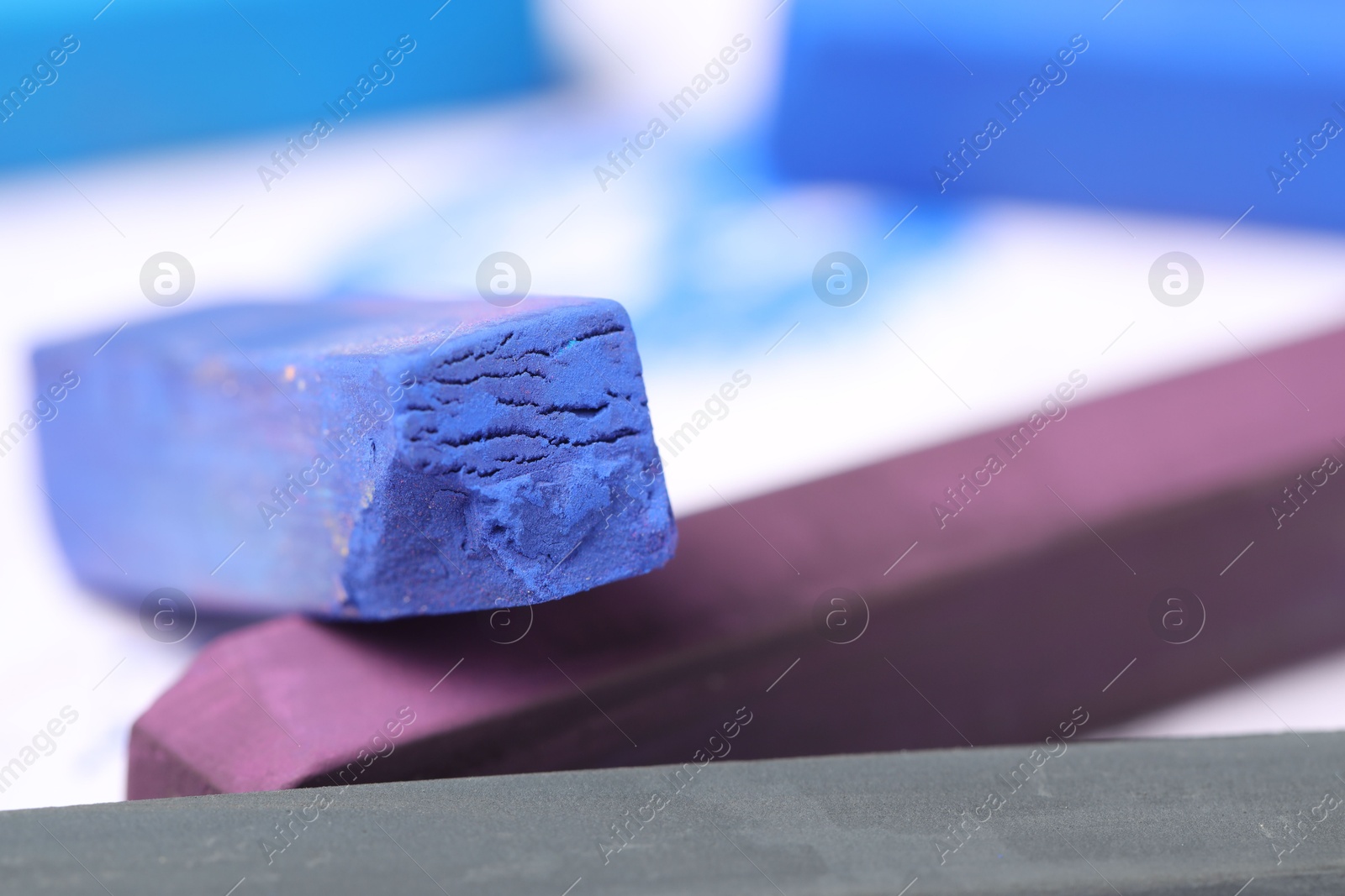 Colorful chalk pastels on white background, closeup Photo of Colorful chalk pastels on white background, closeup