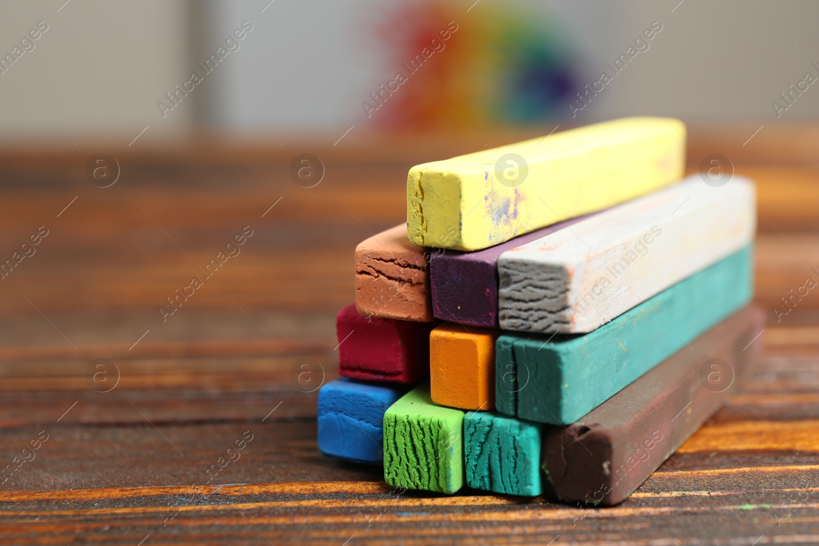 Colorful chalk pastels on wooden table, closeup. Space for text Photo of Colorful chalk pastels on wooden table, closeup. Space for text