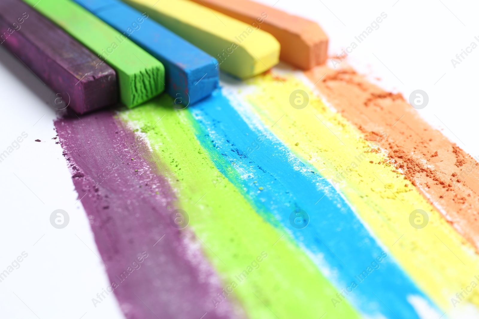 Colorful chalk pastels on white background, closeup Photo of Colorful chalk pastels on white background, closeup