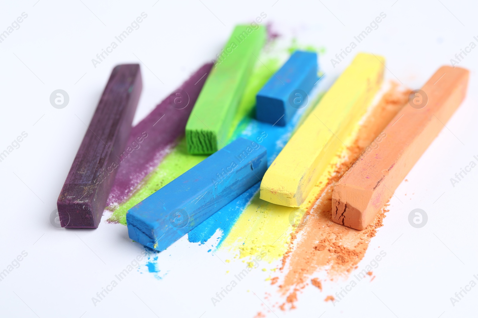 Colorful chalk pastels on white background, closeup Photo of Colorful chalk pastels on white background, closeup