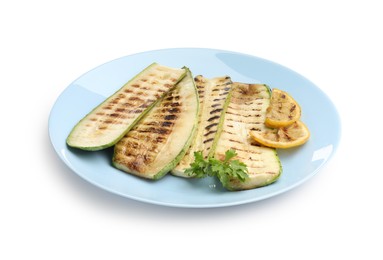 Photo of Delicious grilled courgette slices with parsley and lemon isolated on white