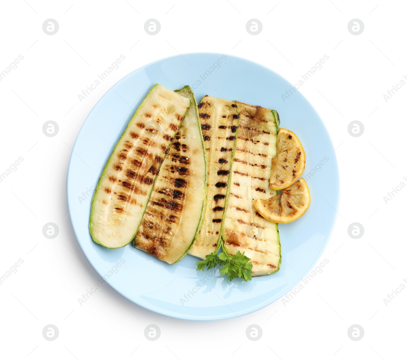 Photo of Delicious grilled courgette slices with parsley and lemon isolated on white, top view