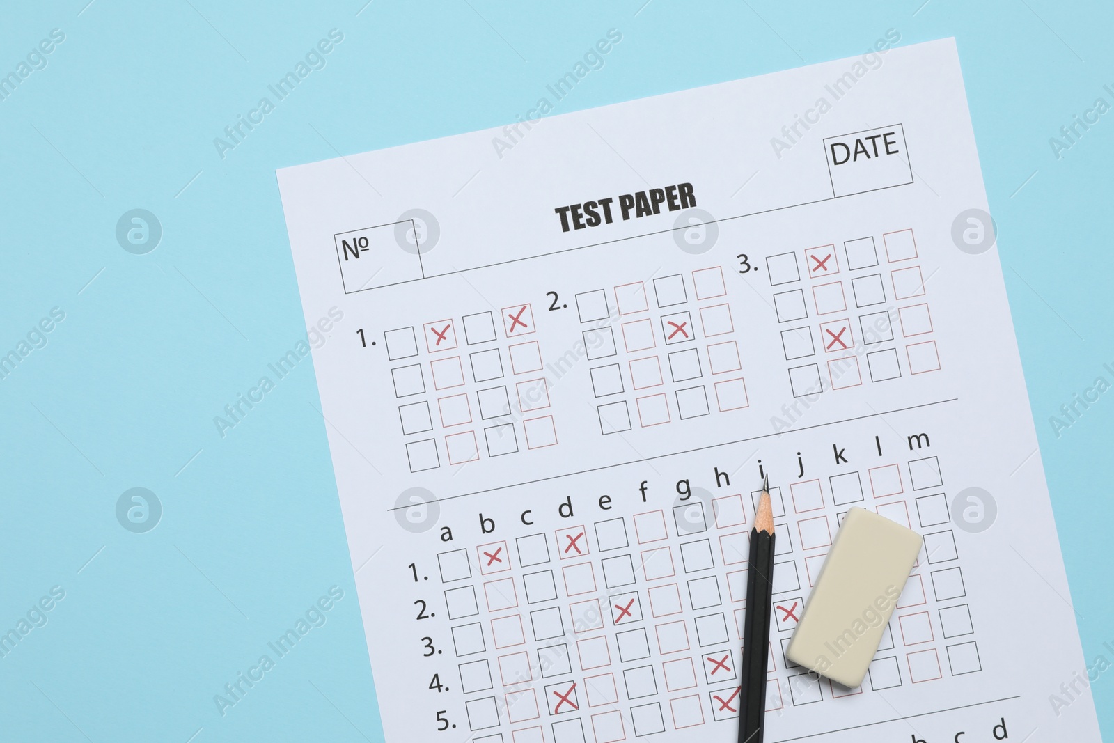 Answer sheet, pencil and eraser on light blue background, flat lay. Student passing exam Photo of Answer sheet, pencil and eraser on light blue background, flat lay. Student passing exam