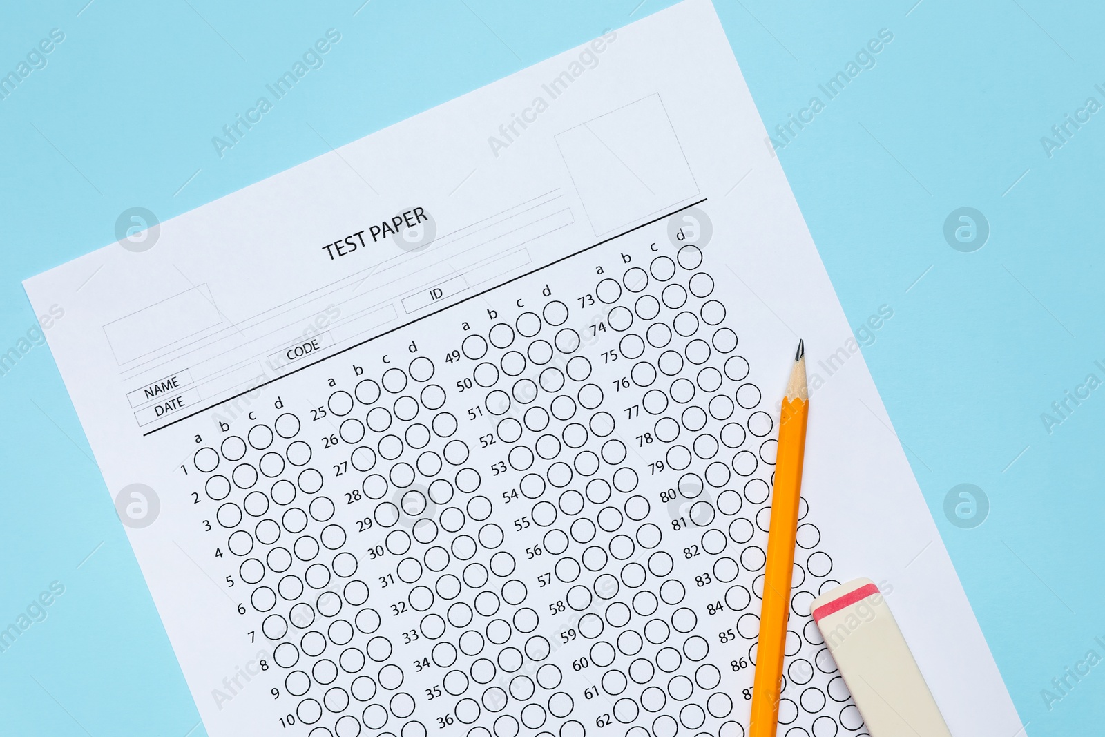 Answer sheet, pencil and eraser on light blue background, flat lay. Student passing exam Photo of Answer sheet, pencil and eraser on light blue background, flat lay. Student passing exam