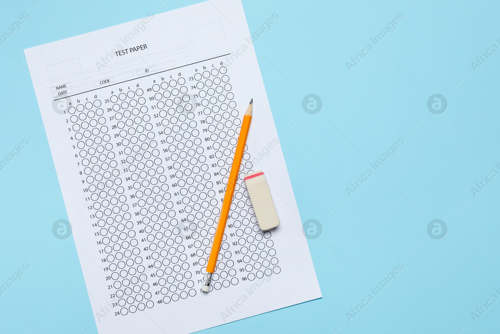 Student passing exam. Answer sheet, eraser and pencil on light blue background, top view. Space for text Photo of Student passing exam. Answer sheet, eraser and pencil on light blue background, top view. Space for text